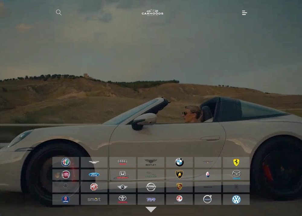 Carhoods Northern website homepage, showing a convertible car and a grid of manufacturer badges